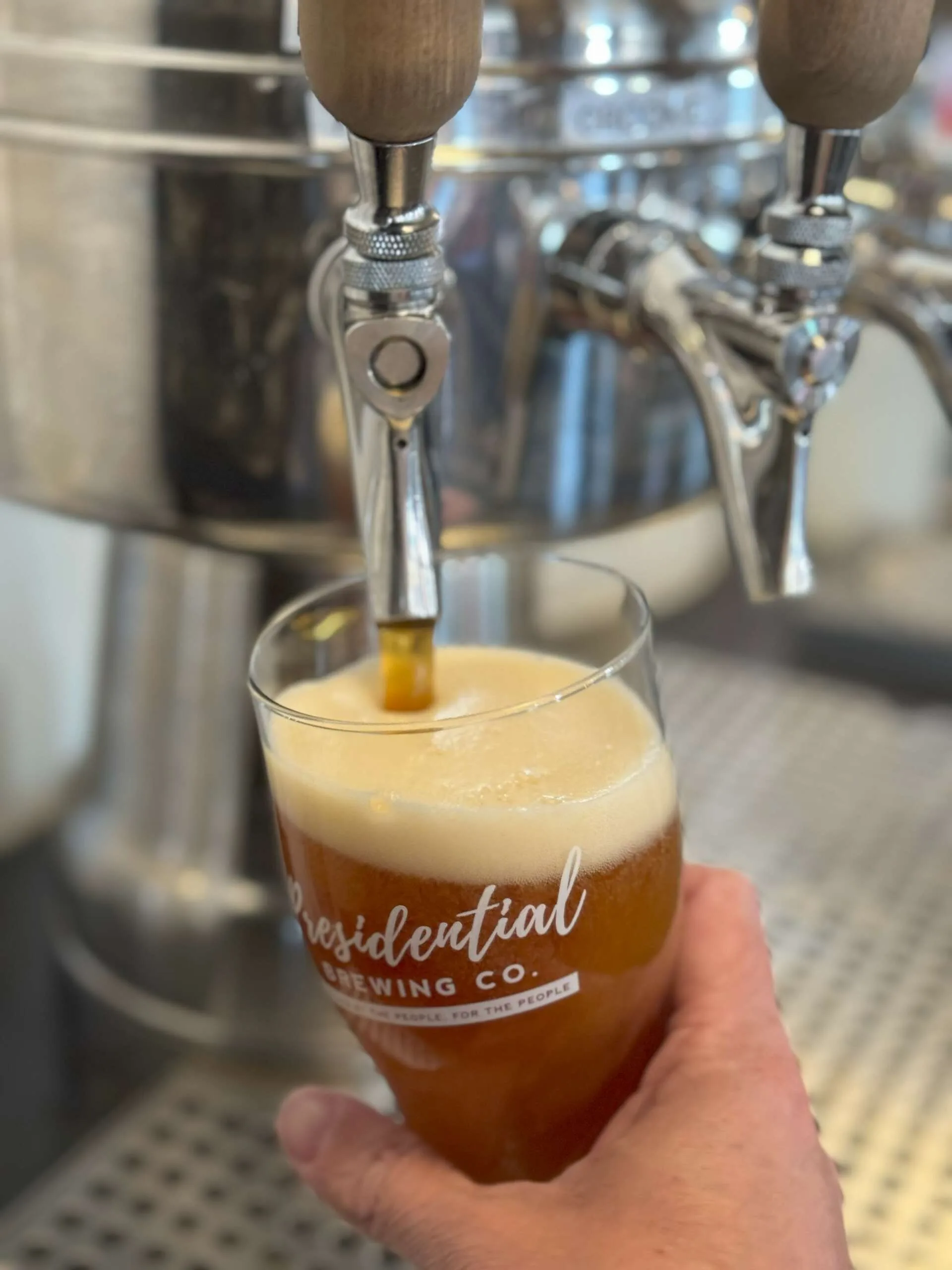 A pint being poured at Presidential Brewing